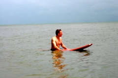 Bron on surfboard at Cocoa Beach